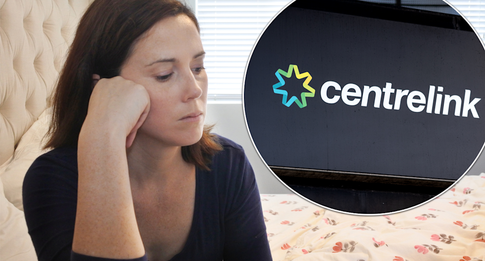 A woman sitting alone and the Centrelink store sign.