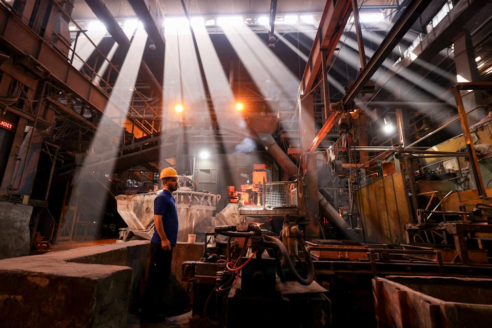Iranian laborers cast and mold car engine parts at Tabriz Tractor Factory, September 2025. (Atta Kenare/AFP via Getty Images)